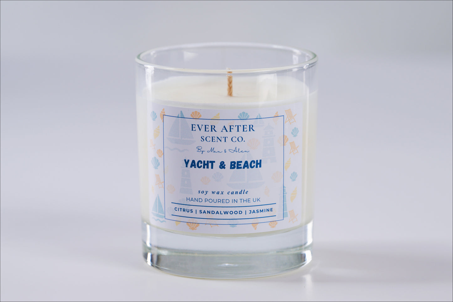 Ever After Scent Co Yacht & Beach Candle in a glass jar with a label on a gray background