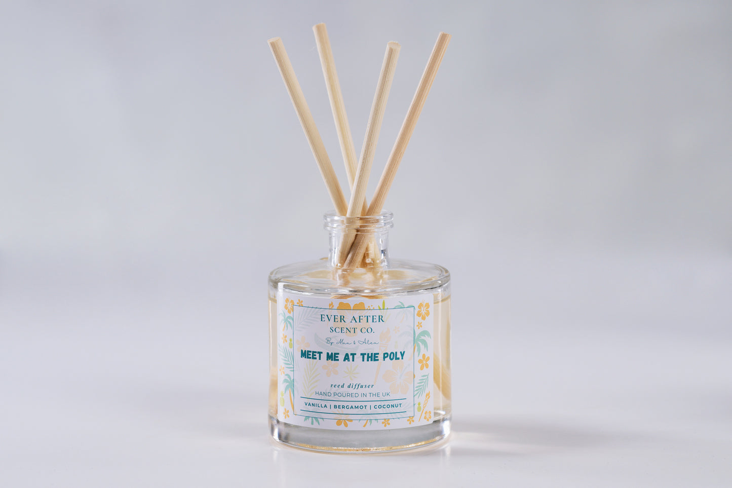 Ever after scent co Meet Me At The Poly Reed diffuser with wooden sticks in a glass bottle on a light gray background