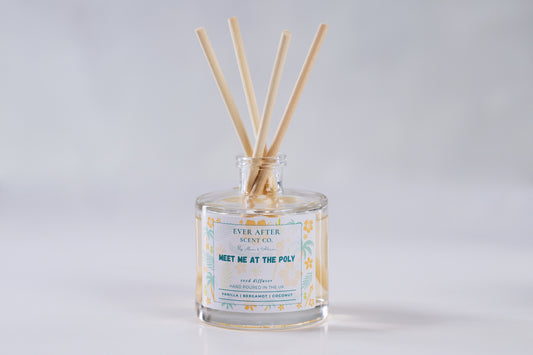Ever after scent co Meet Me At The Poly Reed diffuser with wooden sticks in a glass bottle on a light gray background