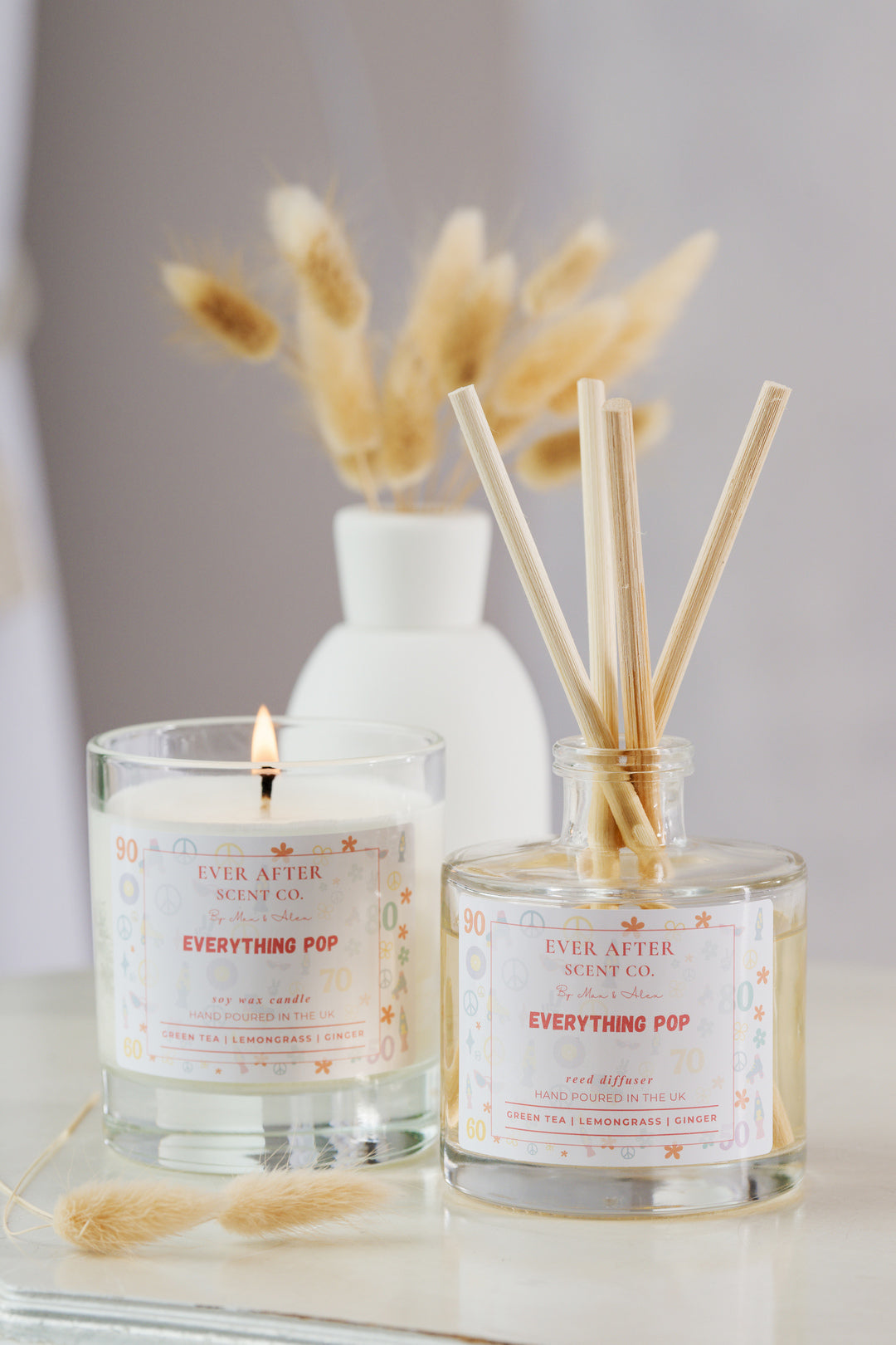 Pop Century Resort Disney Candle and diffuser scent set with 'Ever After Scent Co.' labels on a neutral