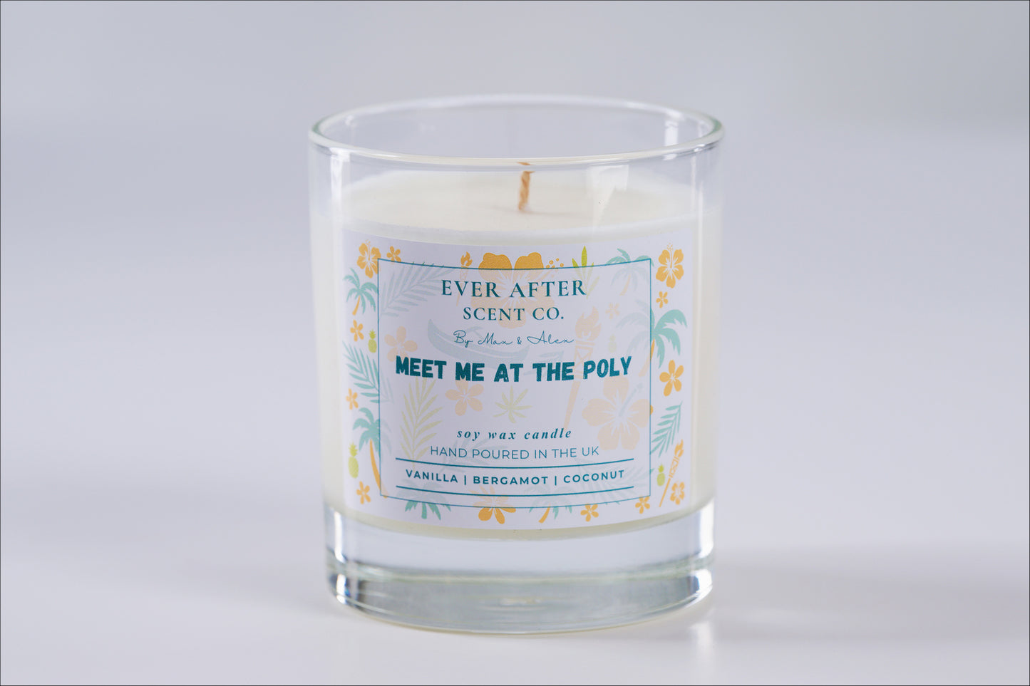 meet me at the poly Candle with a label from Ever After Scent Co. on a light gray background