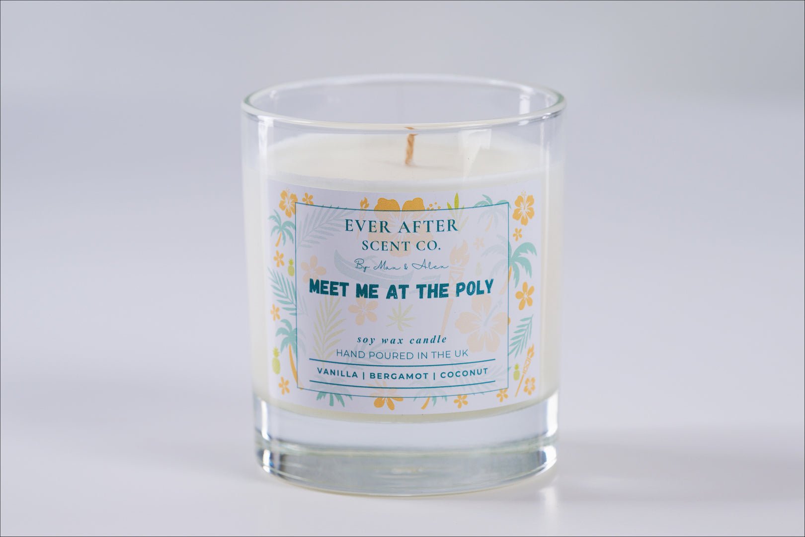 meet me at the poly Candle with a label from Ever After Scent Co. on a light gray background