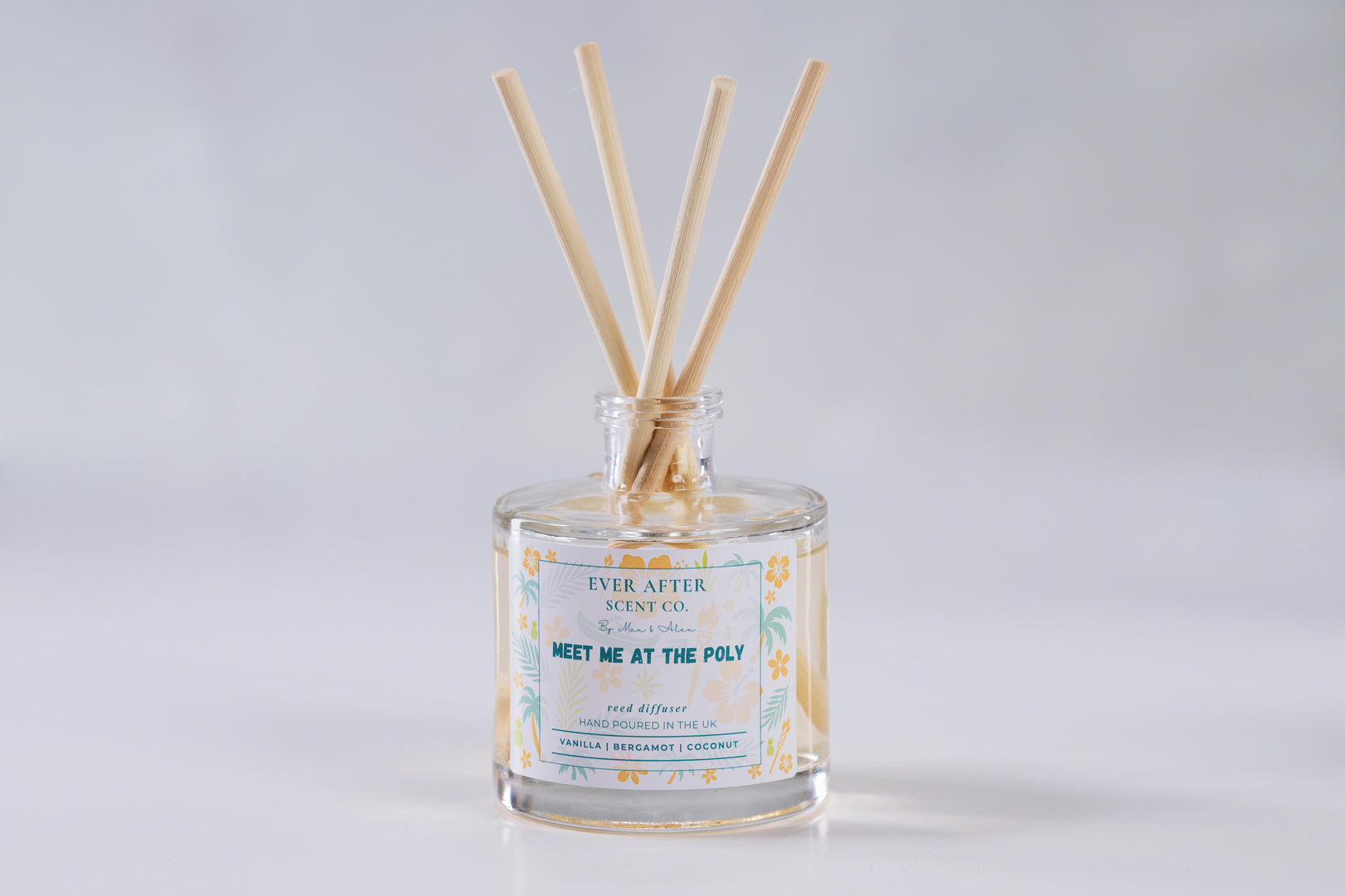 Ever after scent co Meet Me At The Poly Reed diffuser with wooden sticks in a glass bottle on a light gray background