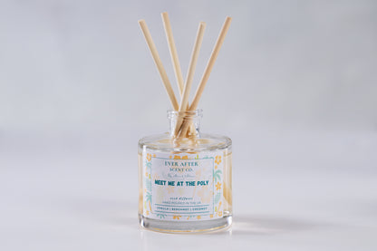 Ever after scent co Meet Me At The Poly Reed diffuser with wooden sticks in a glass bottle on a light gray background