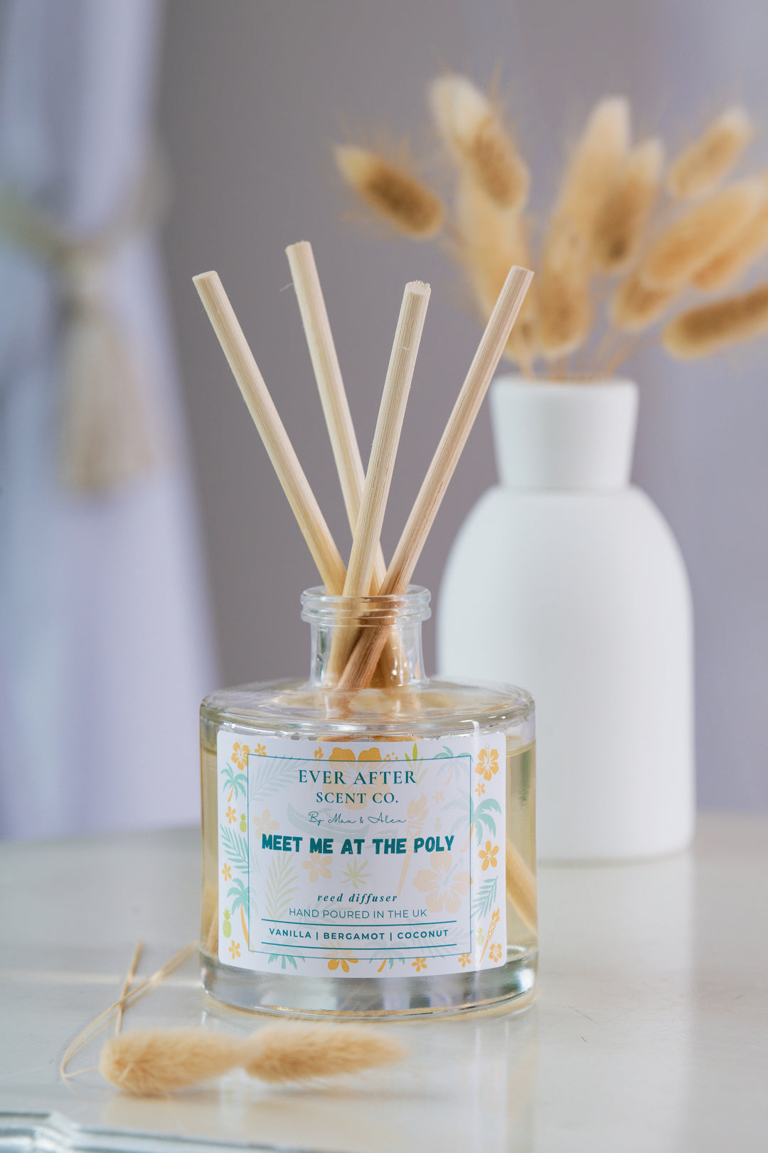 Ever after scent co Meet Me At The Poly Reed diffuser with decorative sticks and a label on a neutral background